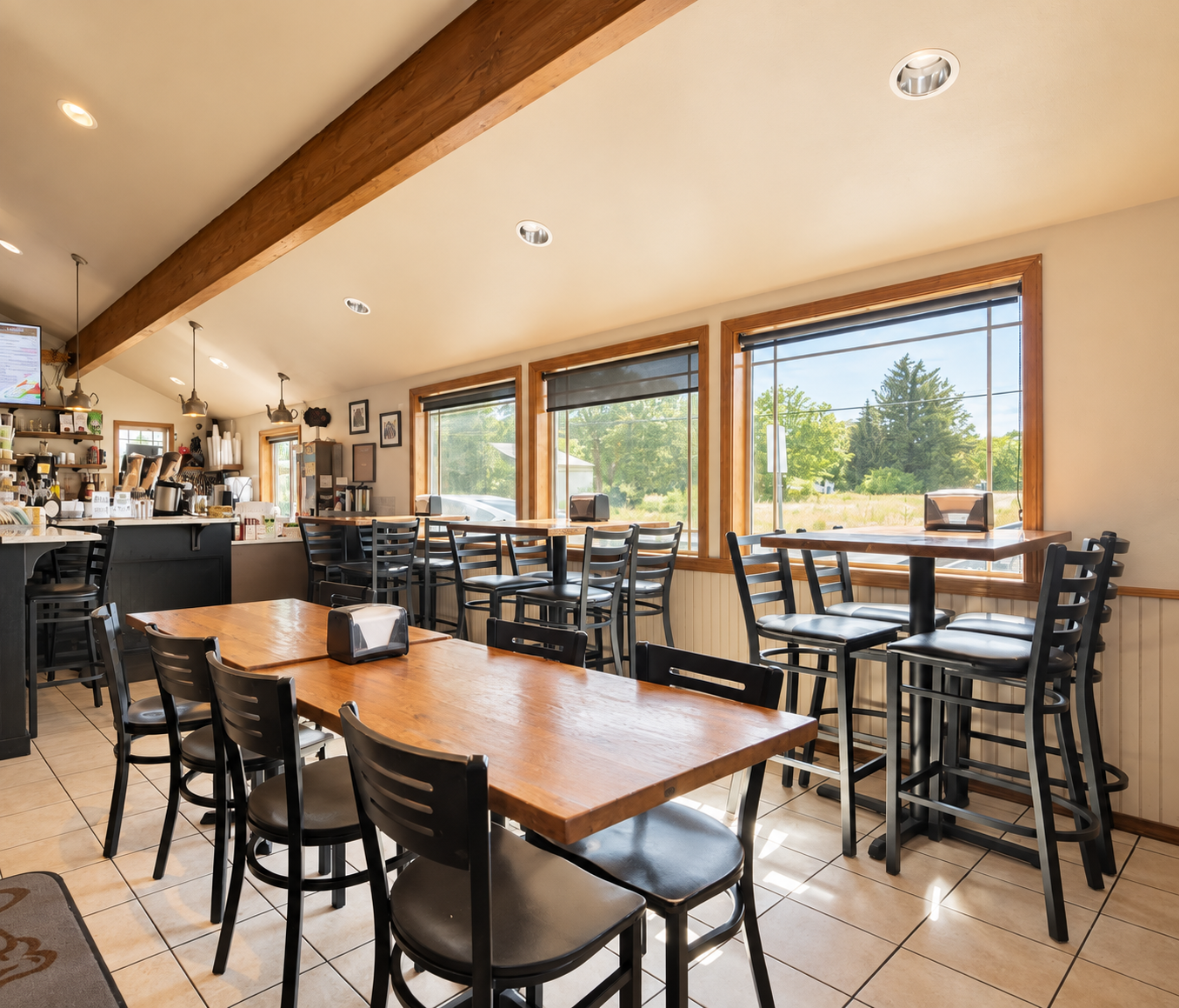 Sunlit tables inside Cozy Coffee & Bistro